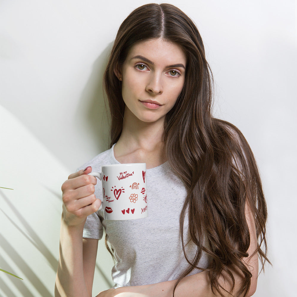 This sweet white ceramic mug is decorated with cute hand-drawn red Valentine-themed doodles, including hearts, lip prints and little flowers. It is printed with the phrase "Be my Valentine", perfect as a lovely gift for your sweetheart on Valentine’s Day. Sip your hot drinks and share your love with this charming cup!