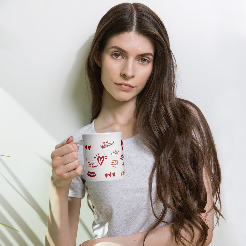 This sweet white ceramic mug is decorated with cute hand-drawn red Valentine-themed doodles, including hearts, lip prints and little flowers. It is printed with the phrase "Be my Valentine", perfect as a lovely gift for your sweetheart on Valentine’s Day. Sip your hot drinks and share your love with this charming cup!
