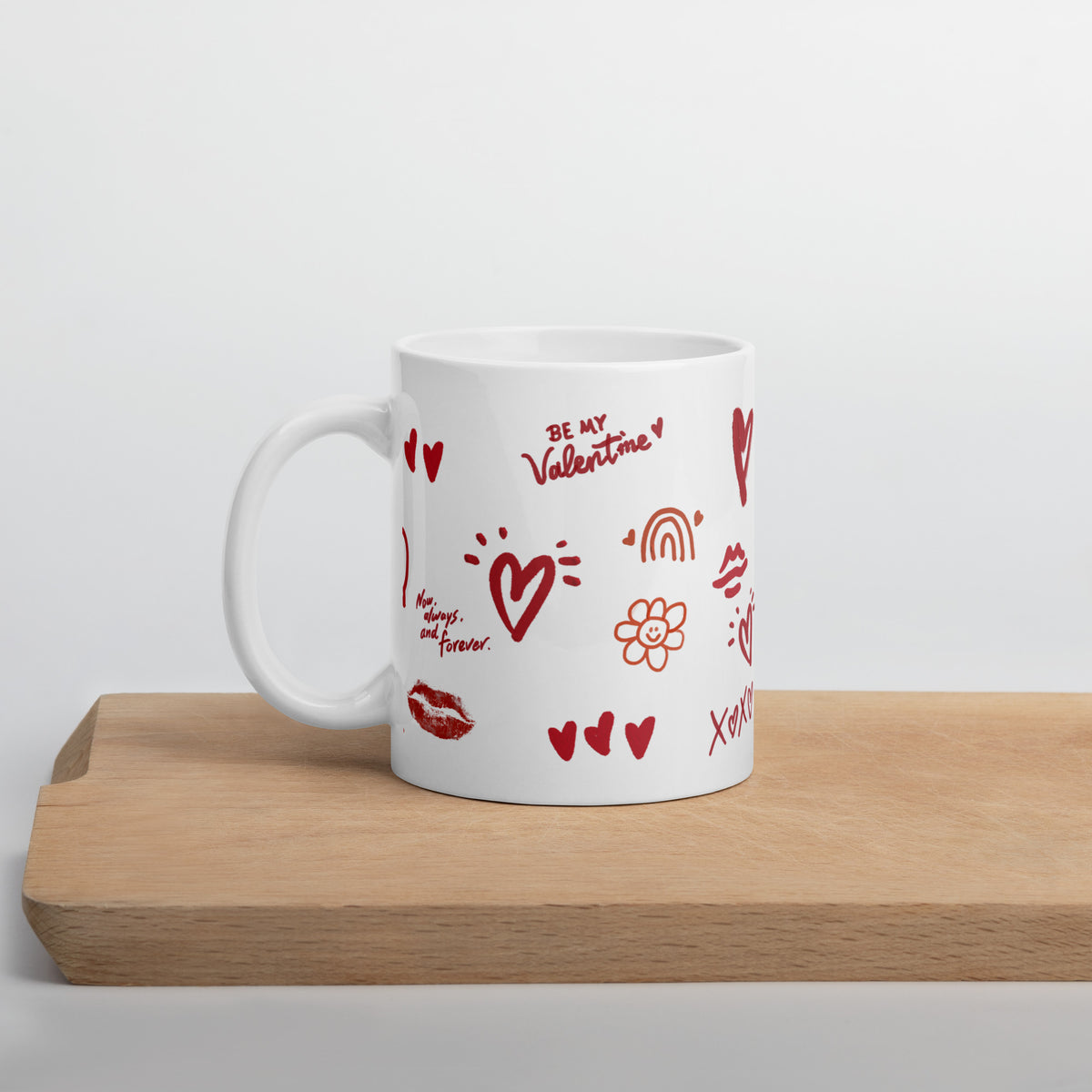 This sweet white ceramic mug is decorated with cute hand-drawn red Valentine-themed doodles, including hearts, lip prints and little flowers. It is printed with the phrase "Be my Valentine", perfect as a lovely gift for your sweetheart on Valentine’s Day. Sip your hot drinks and share your love with this charming cup!