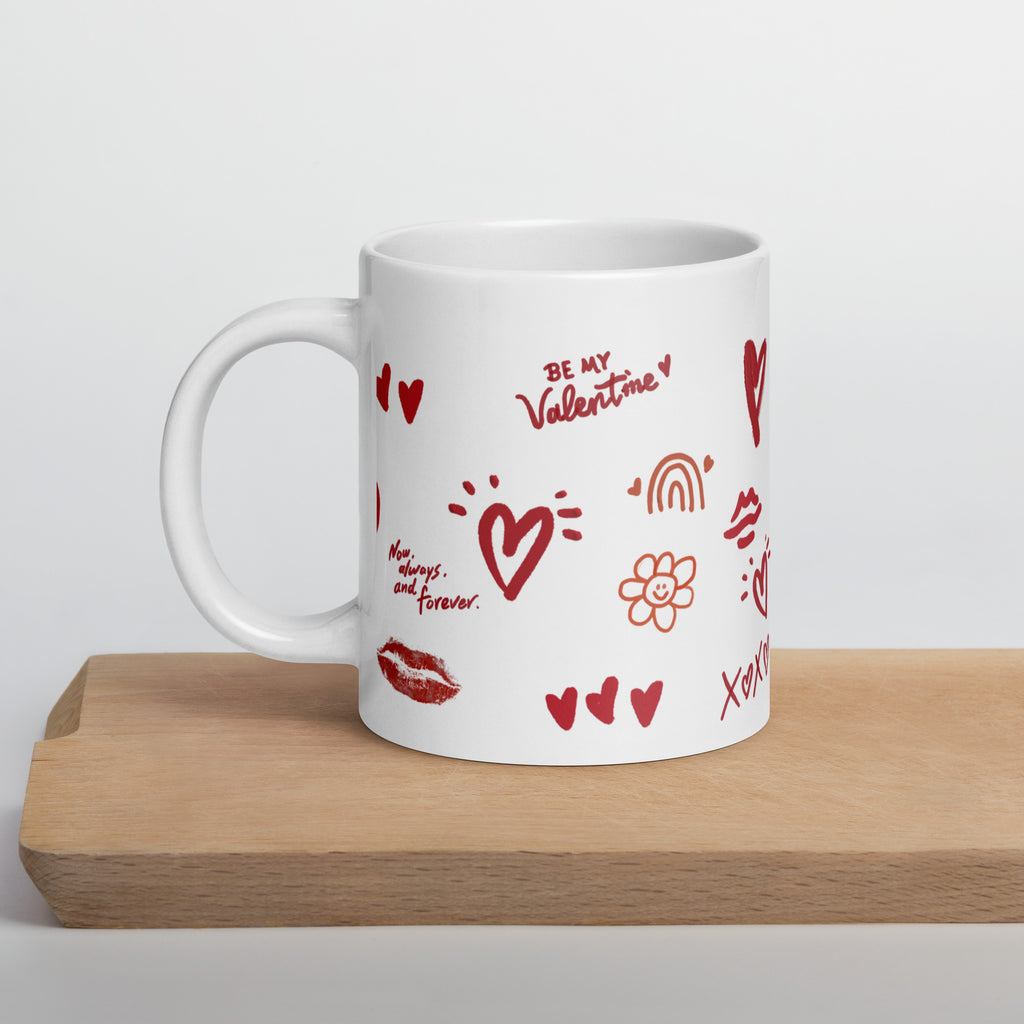 This sweet white ceramic mug is decorated with cute hand-drawn red Valentine-themed doodles, including hearts, lip prints and little flowers. It is printed with the phrase "Be my Valentine", perfect as a lovely gift for your sweetheart on Valentine’s Day. Sip your hot drinks and share your love with this charming cup!