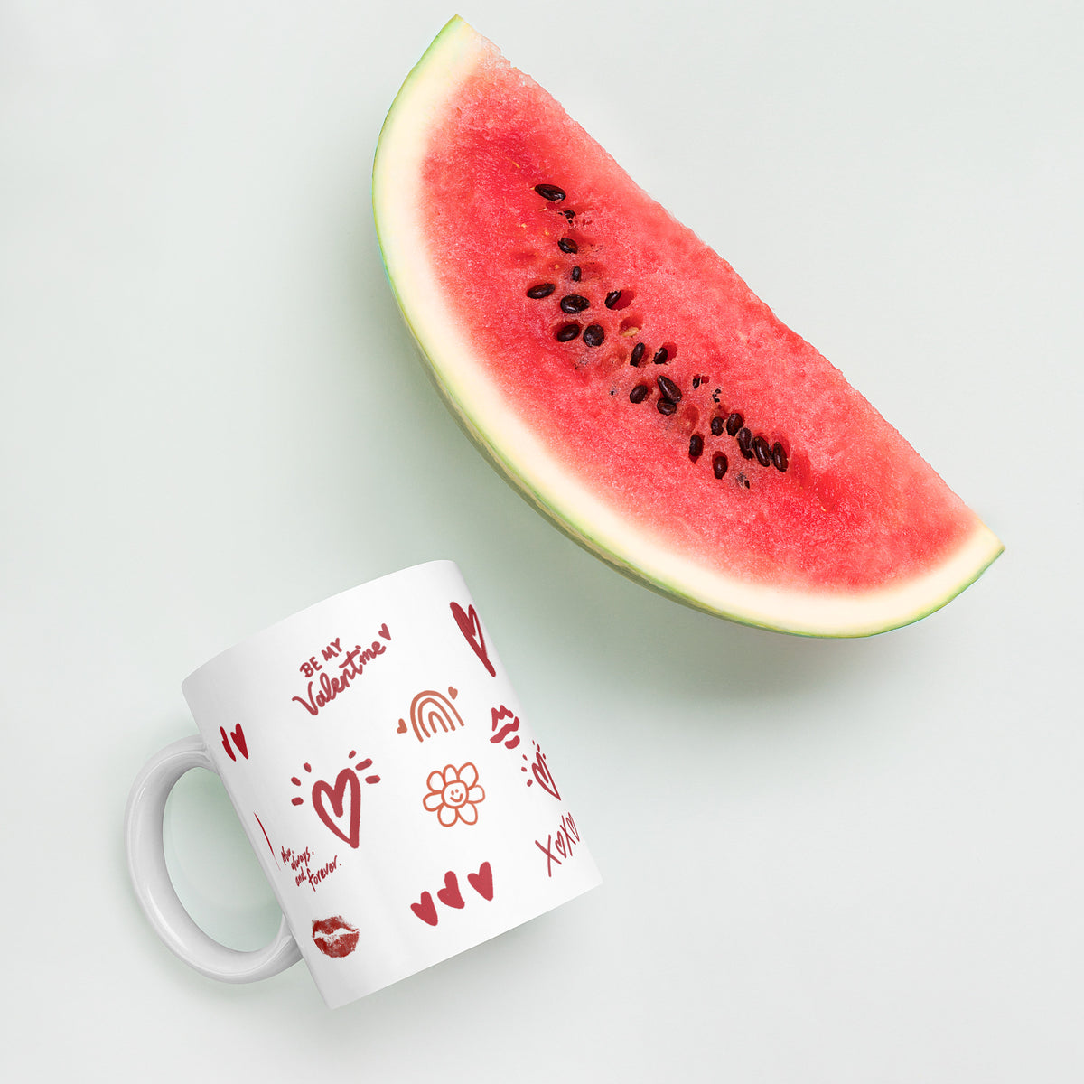 This sweet white ceramic mug is decorated with cute hand-drawn red Valentine-themed doodles, including hearts, lip prints and little flowers. It is printed with the phrase "Be my Valentine", perfect as a lovely gift for your sweetheart on Valentine’s Day. Sip your hot drinks and share your love with this charming cup!