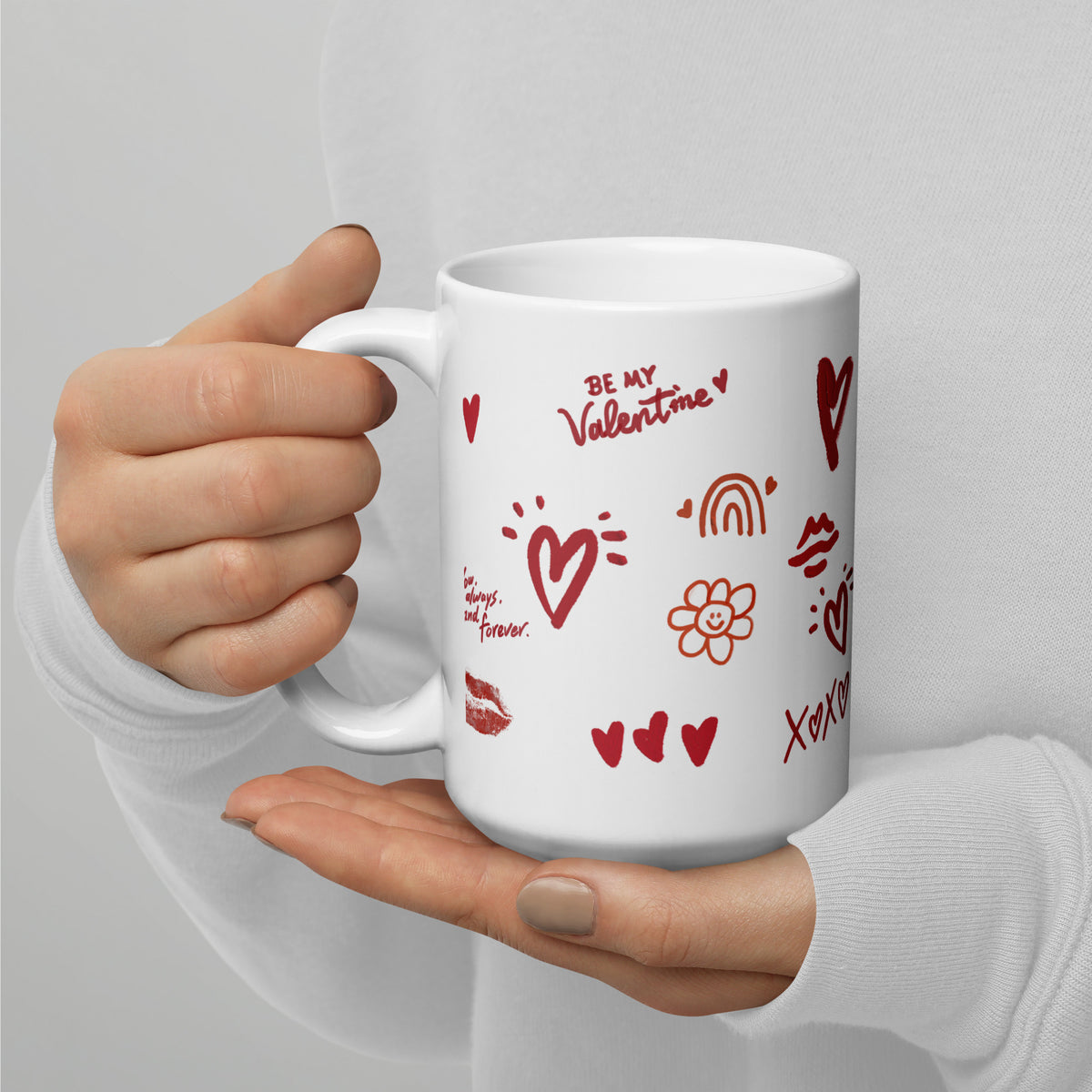 This sweet white ceramic mug is decorated with cute hand-drawn red Valentine-themed doodles, including hearts, lip prints and little flowers. It is printed with the phrase "Be my Valentine", perfect as a lovely gift for your sweetheart on Valentine’s Day. Sip your hot drinks and share your love with this charming cup!