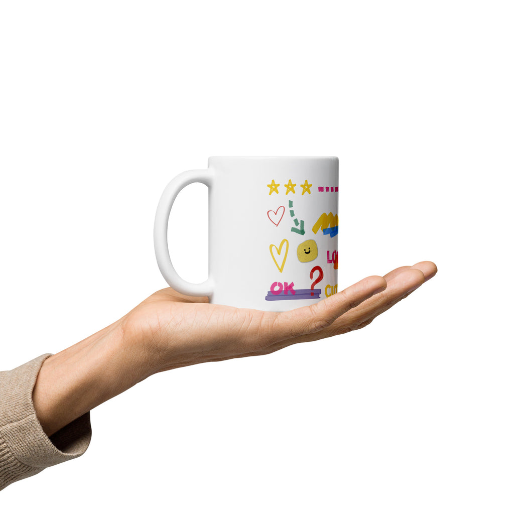 This custom white ceramic mug features an adorable brown poodle portrait surrounded by playful hand-drawn doodles, including hearts, checkmarks and colourful marker strokes.
Vibrant, whimsical decorations wrap around both sides of the cup, making it a sweet personalized gift for dog lovers.
Perfect for enjoying your morning coffee while showing off your love for your furry friend.
