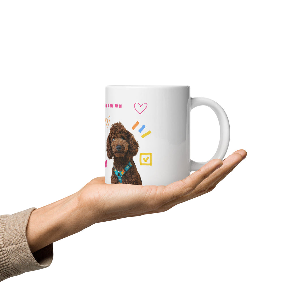 This custom white ceramic mug features an adorable brown poodle portrait surrounded by playful hand-drawn doodles, including hearts, checkmarks and colourful marker strokes.
Vibrant, whimsical decorations wrap around both sides of the cup, making it a sweet personalized gift for dog lovers.
Perfect for enjoying your morning coffee while showing off your love for your furry friend.