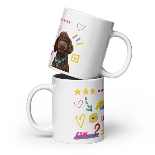 This custom white ceramic mug features an adorable brown poodle portrait surrounded by playful hand-drawn doodles, including hearts, checkmarks and colourful marker strokes.
Vibrant, whimsical decorations wrap around both sides of the cup, making it a sweet personalized gift for dog lovers.
Perfect for enjoying your morning coffee while showing off your love for your furry friend.