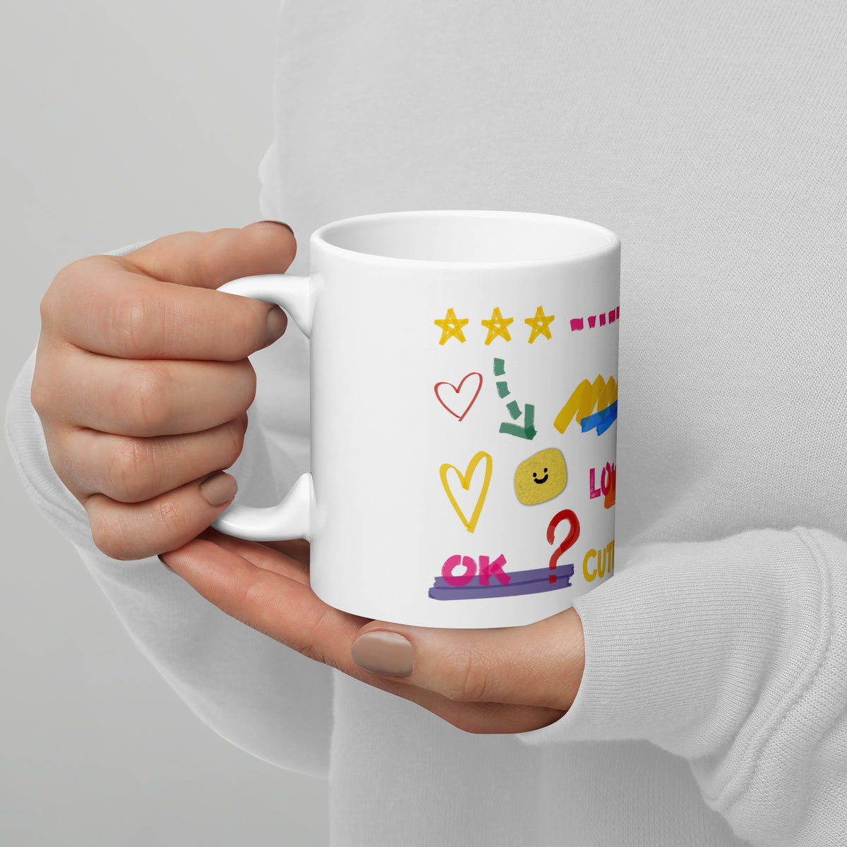 This custom white ceramic mug features an adorable brown poodle portrait surrounded by playful hand-drawn doodles, including hearts, checkmarks and colourful marker strokes.
Vibrant, whimsical decorations wrap around both sides of the cup, making it a sweet personalized gift for dog lovers.
Perfect for enjoying your morning coffee while showing off your love for your furry friend.