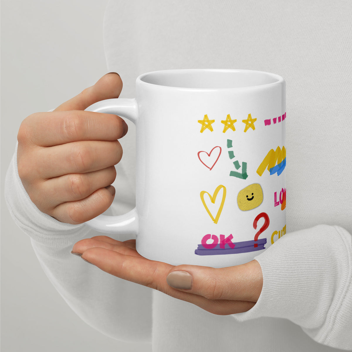 This custom white ceramic mug features an adorable brown poodle portrait surrounded by playful hand-drawn doodles, including hearts, checkmarks and colourful marker strokes.
Vibrant, whimsical decorations wrap around both sides of the cup, making it a sweet personalized gift for dog lovers.
Perfect for enjoying your morning coffee while showing off your love for your furry friend.
