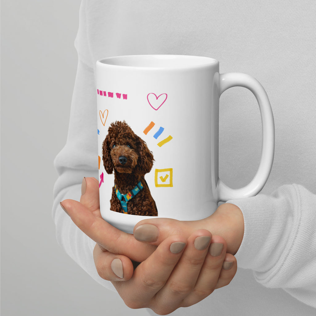 This custom white ceramic mug features an adorable brown poodle portrait surrounded by playful hand-drawn doodles, including hearts, checkmarks and colourful marker strokes.
Vibrant, whimsical decorations wrap around both sides of the cup, making it a sweet personalized gift for dog lovers.
Perfect for enjoying your morning coffee while showing off your love for your furry friend.