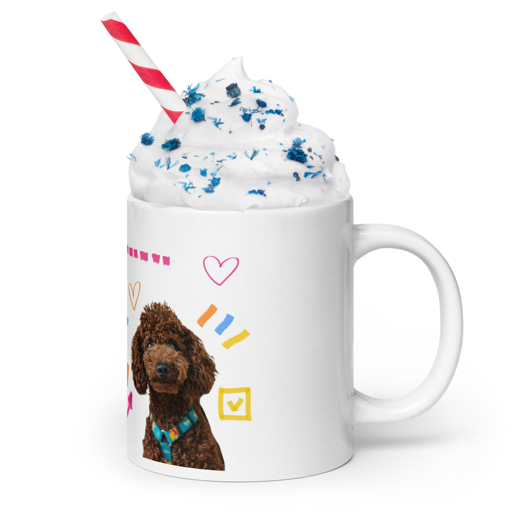 This custom white ceramic mug features an adorable brown poodle portrait surrounded by playful hand-drawn doodles, including hearts, checkmarks and colourful marker strokes.
Vibrant, whimsical decorations wrap around both sides of the cup, making it a sweet personalized gift for dog lovers.
Perfect for enjoying your morning coffee while showing off your love for your furry friend.