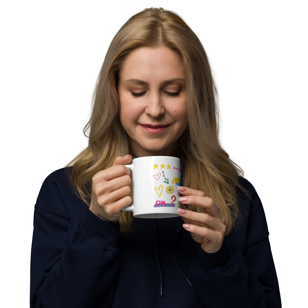 This custom white ceramic mug features an adorable brown poodle portrait surrounded by playful hand-drawn doodles, including hearts, checkmarks and colourful marker strokes.
Vibrant, whimsical decorations wrap around both sides of the cup, making it a sweet personalized gift for dog lovers.
Perfect for enjoying your morning coffee while showing off your love for your furry friend.