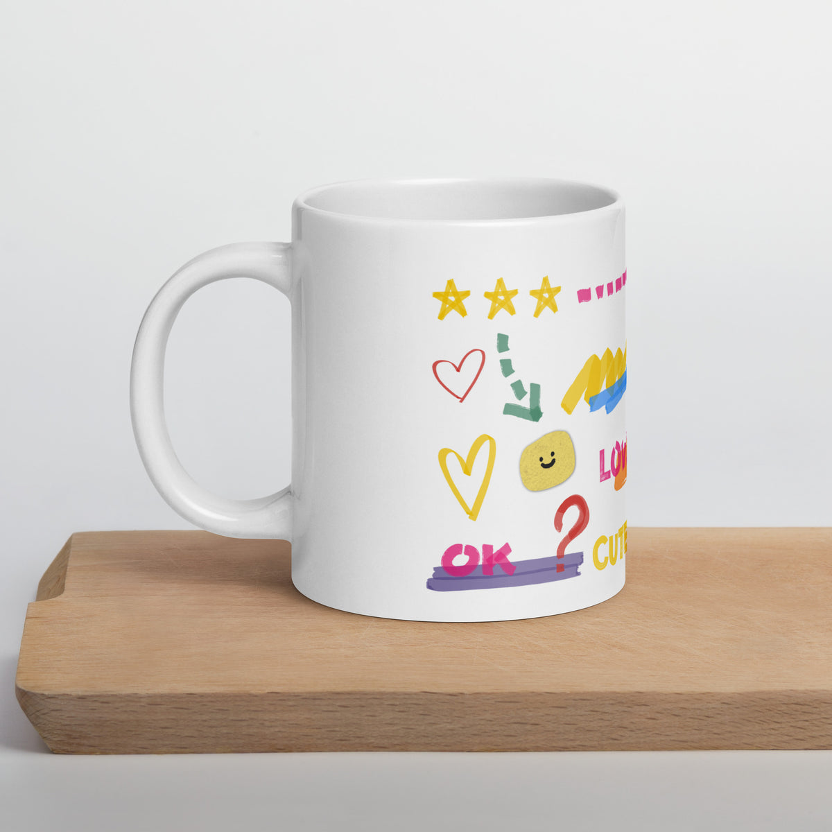 This custom white ceramic mug features an adorable brown poodle portrait surrounded by playful hand-drawn doodles, including hearts, checkmarks and colourful marker strokes.
Vibrant, whimsical decorations wrap around both sides of the cup, making it a sweet personalized gift for dog lovers.
Perfect for enjoying your morning coffee while showing off your love for your furry friend.
