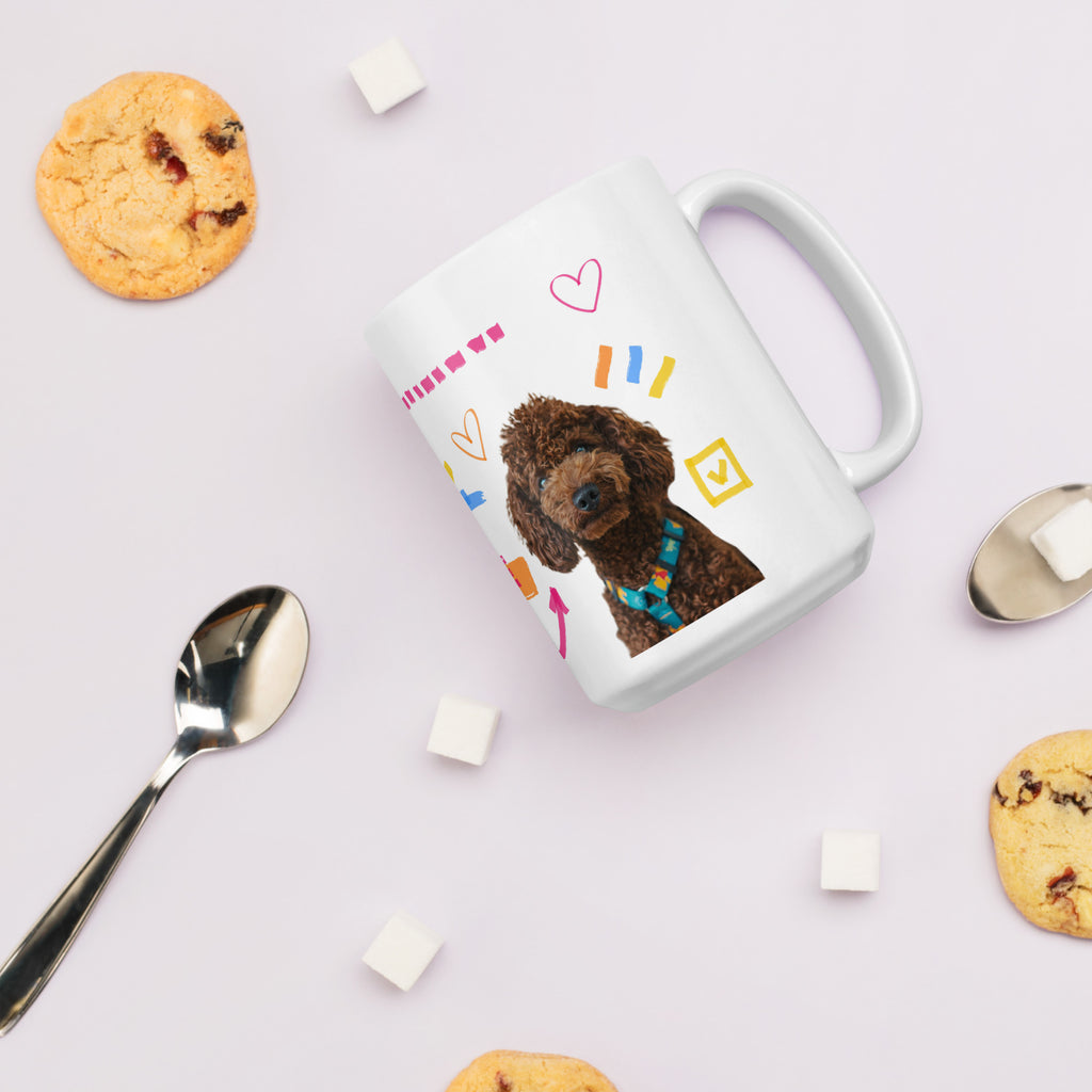 This custom white ceramic mug features an adorable brown poodle portrait surrounded by playful hand-drawn doodles, including hearts, checkmarks and colourful marker strokes.
Vibrant, whimsical decorations wrap around both sides of the cup, making it a sweet personalized gift for dog lovers.
Perfect for enjoying your morning coffee while showing off your love for your furry friend.