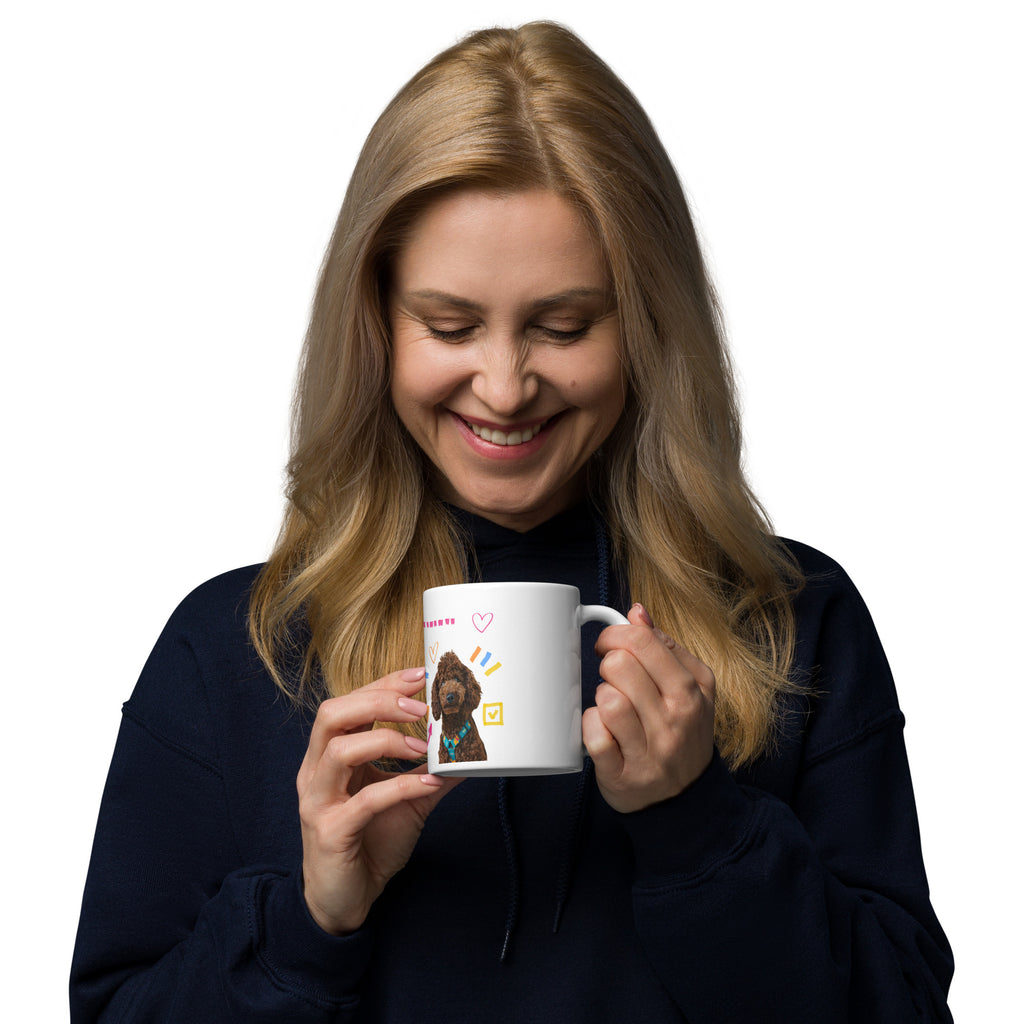 This custom white ceramic mug features an adorable brown poodle portrait surrounded by playful hand-drawn doodles, including hearts, checkmarks and colourful marker strokes.
Vibrant, whimsical decorations wrap around both sides of the cup, making it a sweet personalized gift for dog lovers.
Perfect for enjoying your morning coffee while showing off your love for your furry friend.