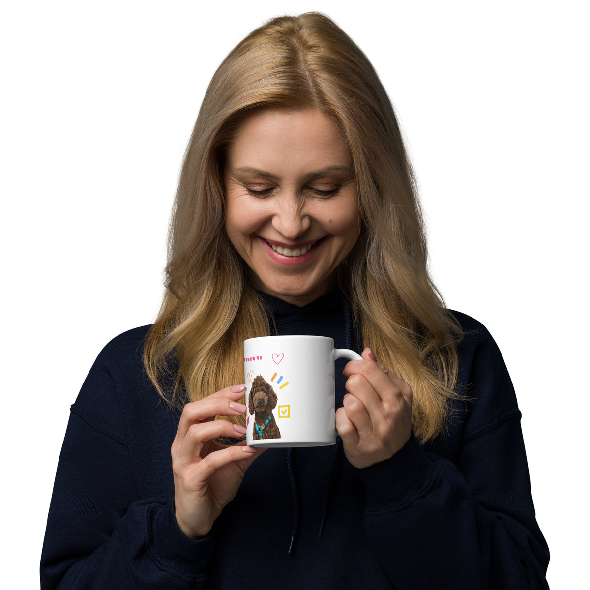 This custom white ceramic mug features an adorable brown poodle portrait surrounded by playful hand-drawn doodles, including hearts, checkmarks and colourful marker strokes.
Vibrant, whimsical decorations wrap around both sides of the cup, making it a sweet personalized gift for dog lovers.
Perfect for enjoying your morning coffee while showing off your love for your furry friend.