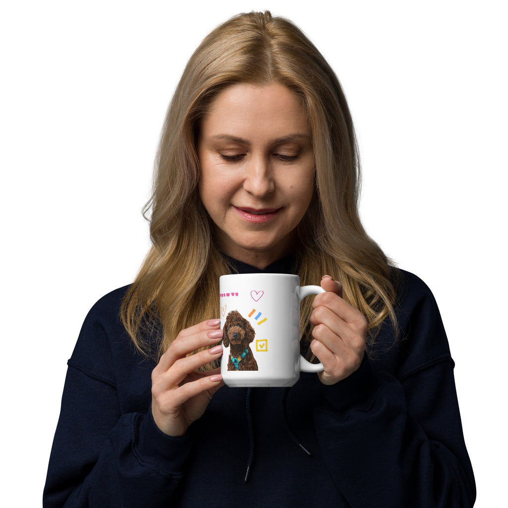 This custom white ceramic mug features an adorable brown poodle portrait surrounded by playful hand-drawn doodles, including hearts, checkmarks and colourful marker strokes.
Vibrant, whimsical decorations wrap around both sides of the cup, making it a sweet personalized gift for dog lovers.
Perfect for enjoying your morning coffee while showing off your love for your furry friend.